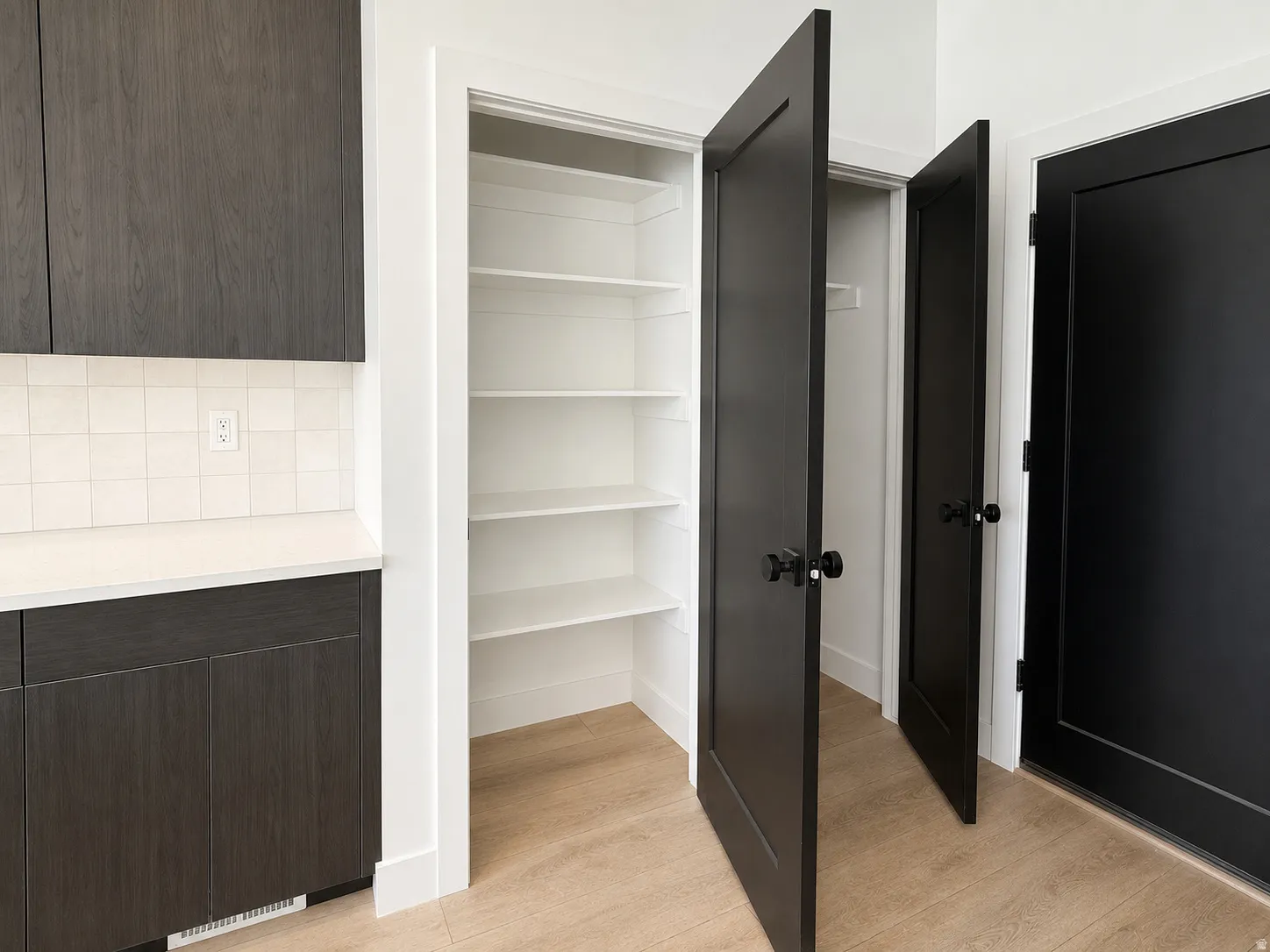 Built-in pantry with five adjustable shelves