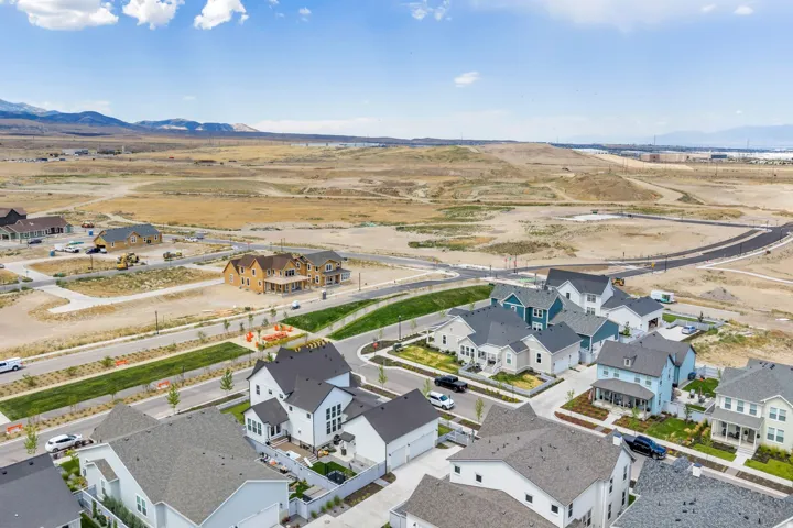 Aerial perspective showcasing a developing residential community with contemporary homes featuring varied architectural styles and rooflines