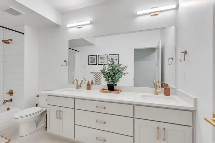 White double vanity with integrated sinks and a light-toned countertop