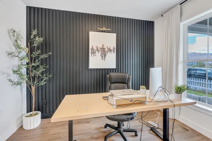Accent wall with vertical black paneling provides a focal point