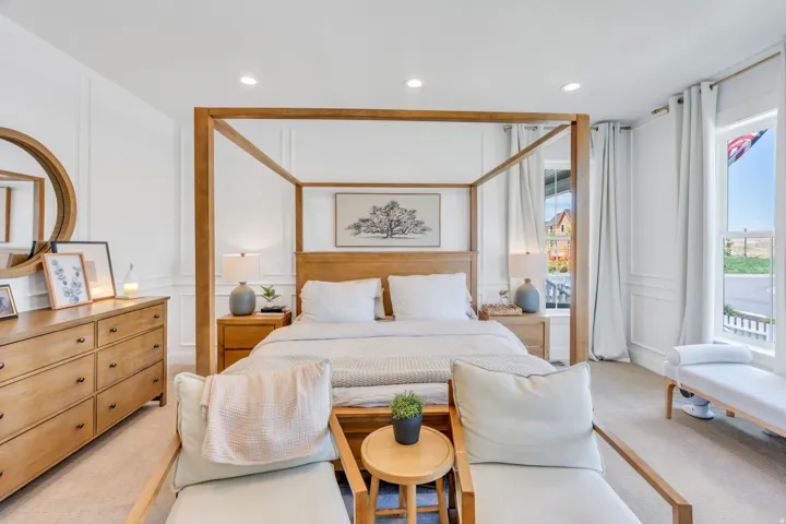 Bedroom featuring wainscoting, recessed lighting, and large windows