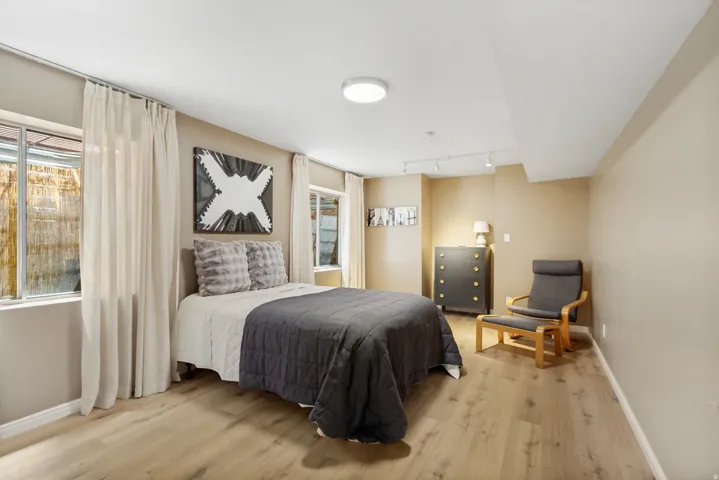 Room featuring wood-finish flooring, recessed lighting, and neutral wall tones