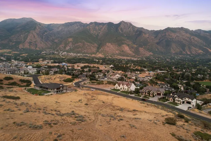 Expansive mountain backdrop framing a residential area with varied architectural styles