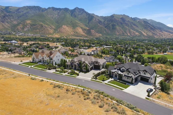 New construction residences featuring varied architectural styles and integrated garages