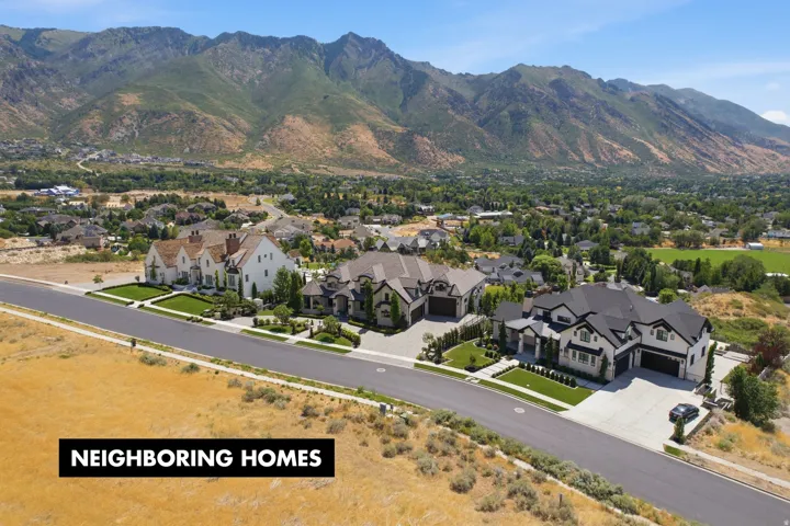 Expansive mountain backdrop framing a residential area with varied architectural styles