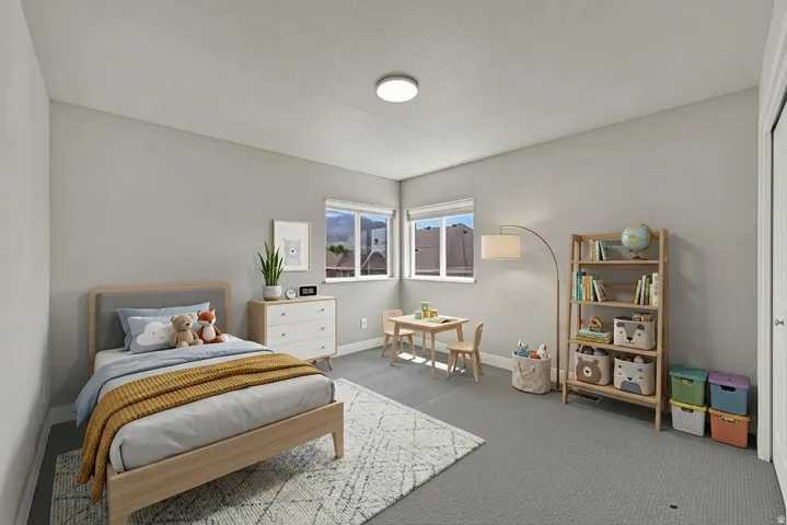 Neutral tone wall paint in a room featuring two windows with blinds