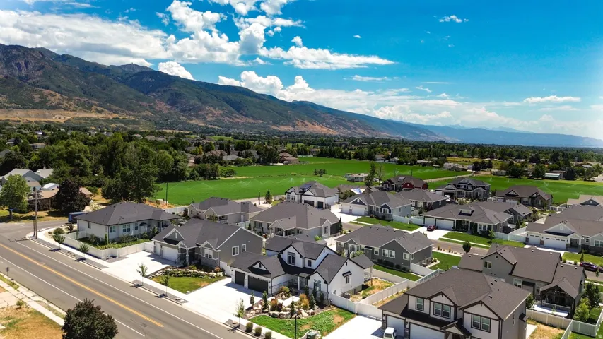 New construction residential development featuring modern single-family homes with mountain and valley backdrops