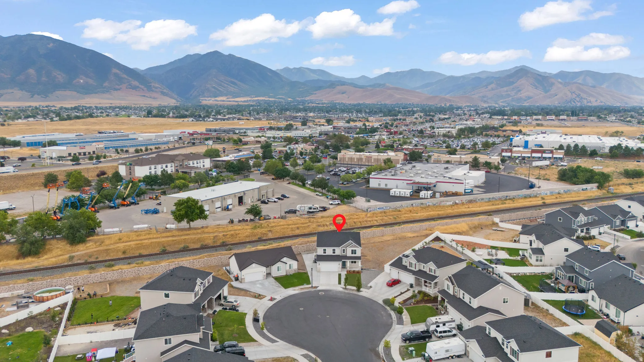 Elevated aerial perspective showcasing a two-story residence situated on a cul-de-sac