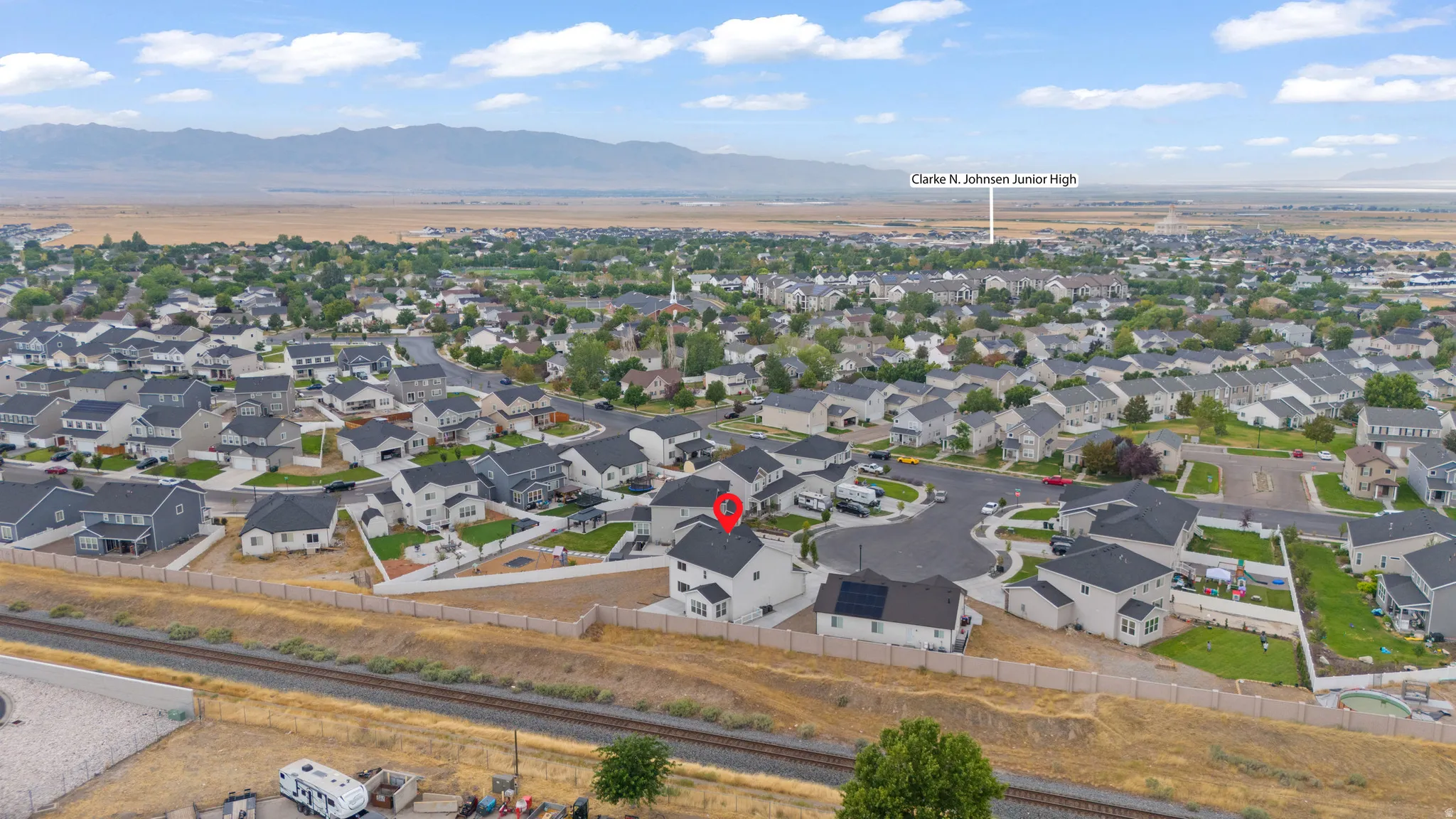 Aerial view of a residential neighborhood with a mountain backdrop