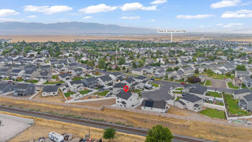 Aerial view of a residential neighborhood with a mountain backdrop