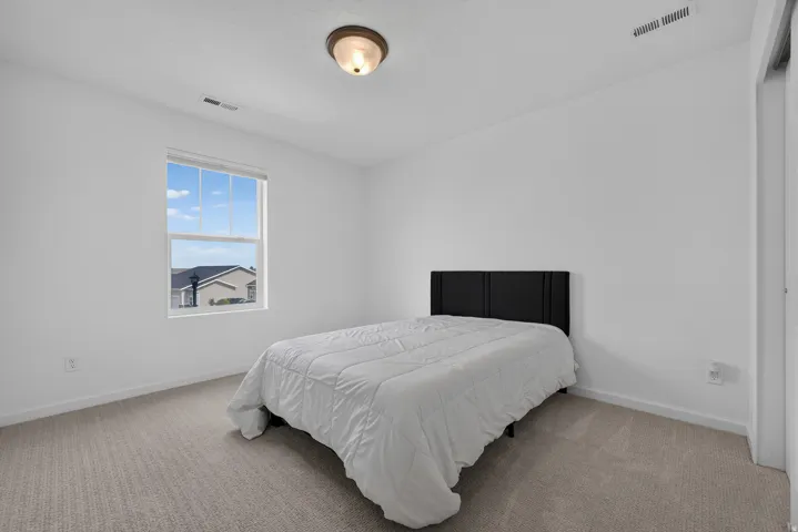 Neutral wall finishes and carpeted flooring