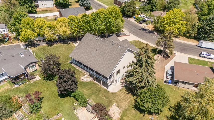 Expansive property featuring a multi-level structure with a covered porch and upper-level deck