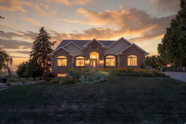 Brick and stucco exterior featuring multiple arched windows