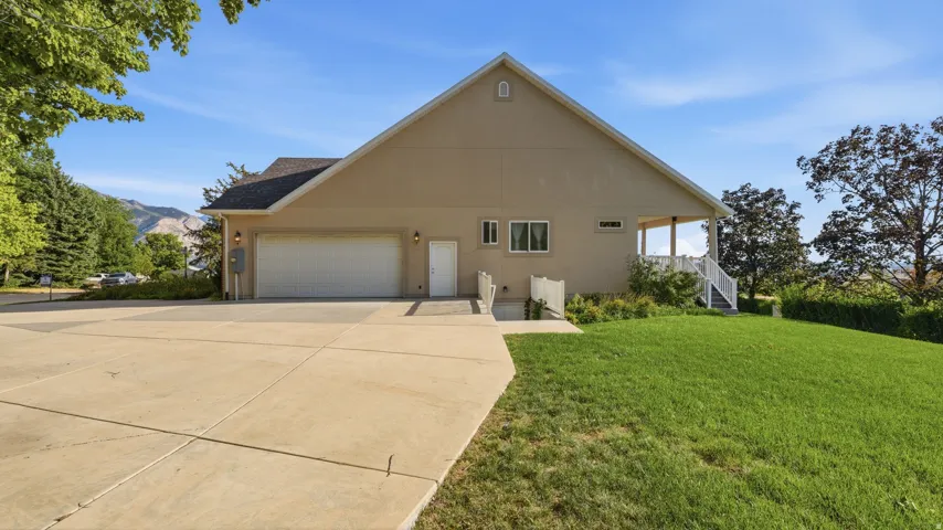 Two-car garage with concrete driveway
