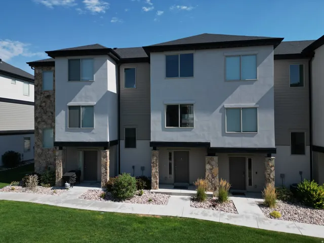 Contemporary multi-story exterior featuring a mix of stucco and horizontal siding