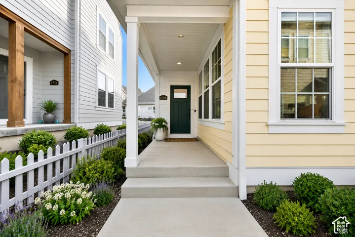 Covered front porch with recessed lighting