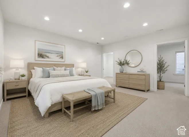 Spacious room featuring neutral carpeting and recessed lighting