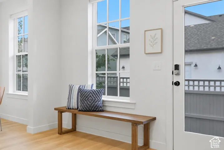 Light wood-finish flooring complements white walls and trim