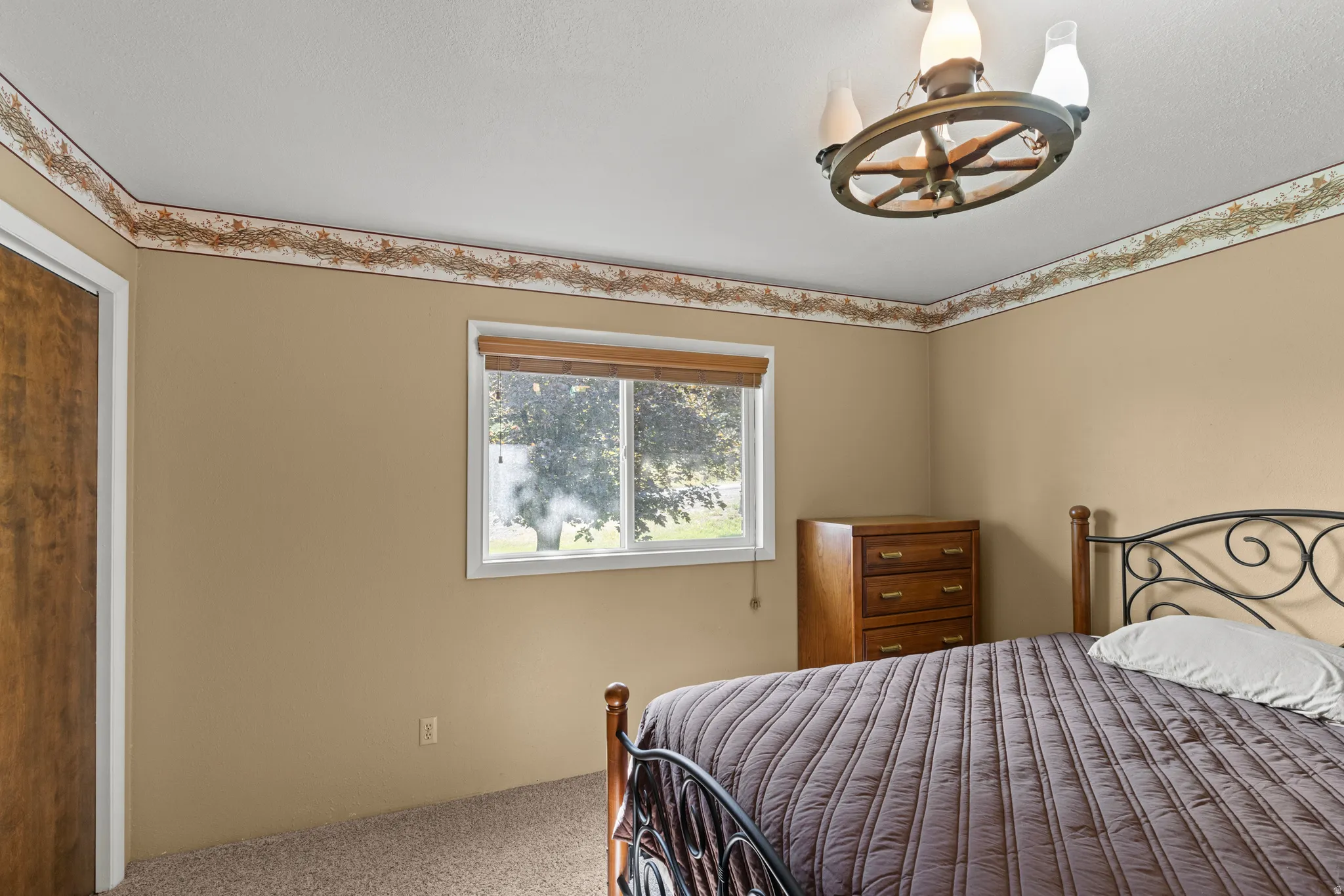 Carpeting and a window with blinds