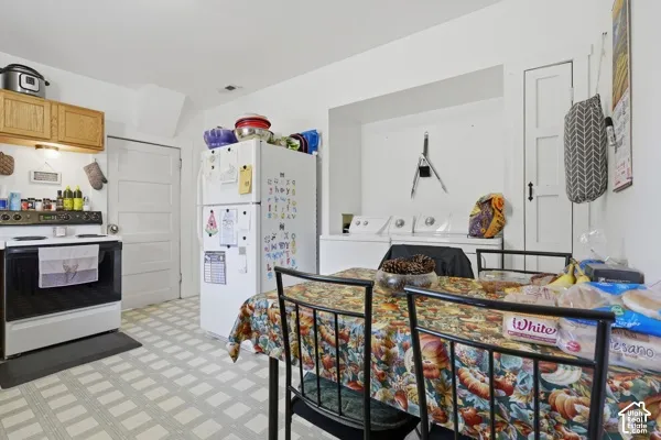 Kitchen area featuring a built-in oven, overhead cabinetry, and patterned flooring