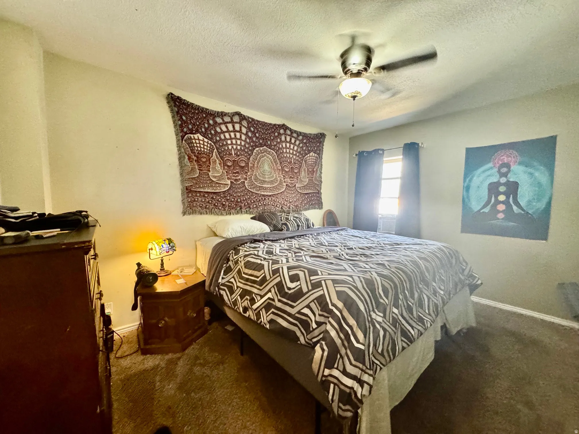 Bedroom featuring carpet flooring and a ceiling fan with integrated lighting