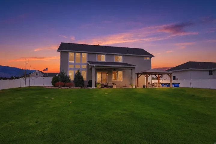 Expansive green lawn with a privacy fence