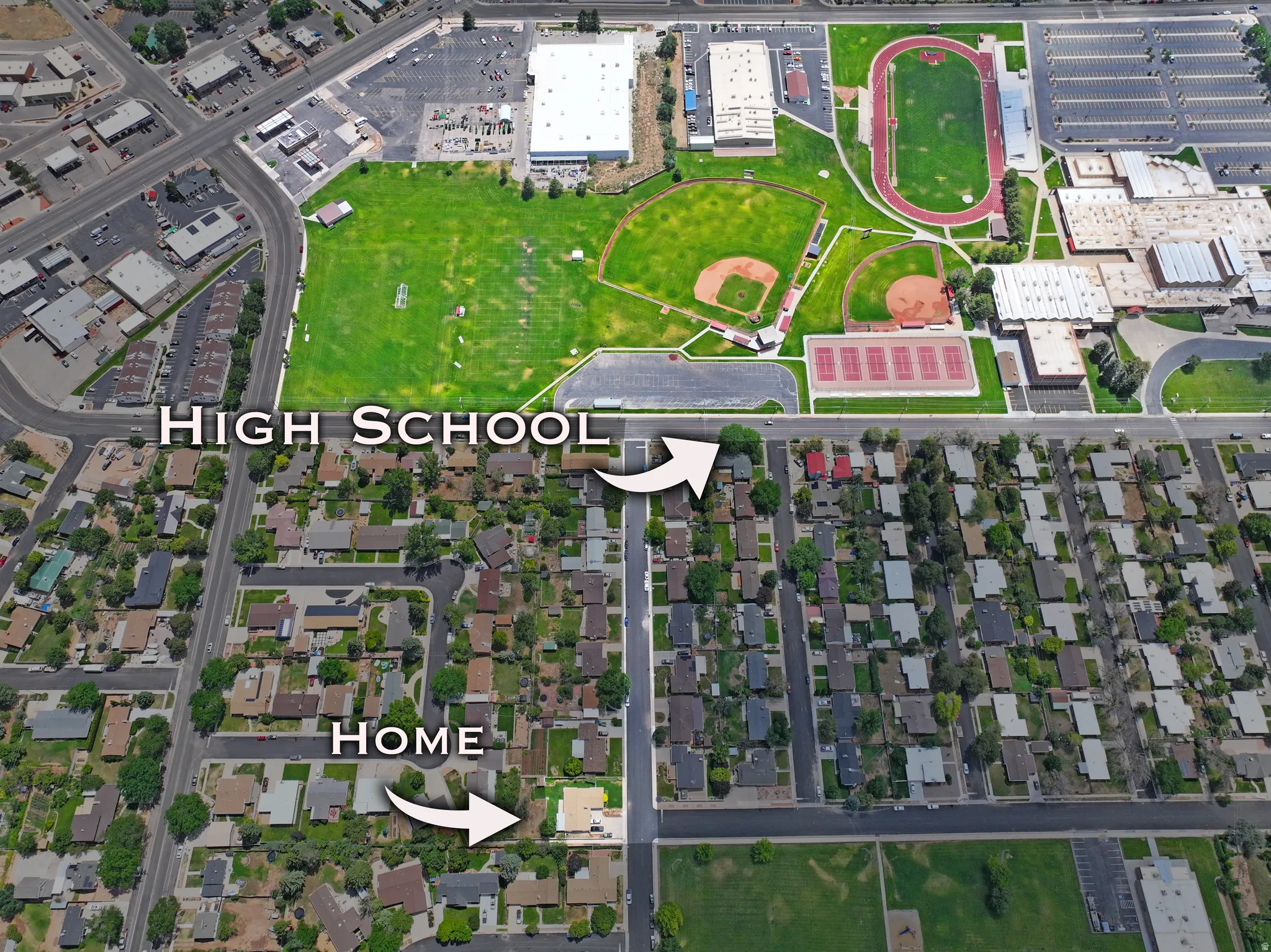 Aerial perspective showcasing the residential neighborhood and nearby high school campus
