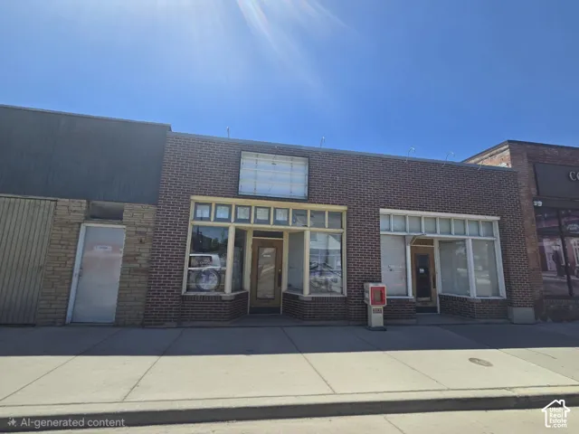 Commercial storefront featuring a brick facade with multiple display windows