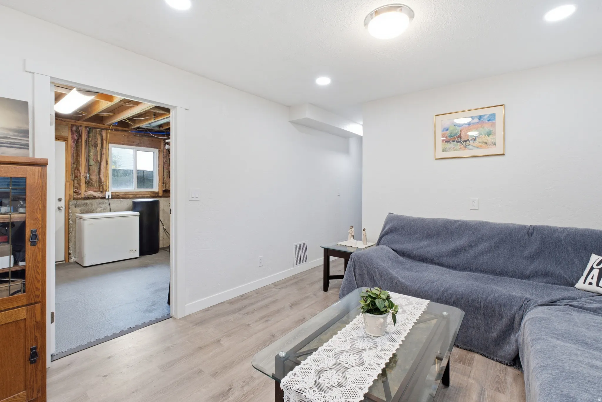Finished interior room with recessed lighting and wood-finish flooring