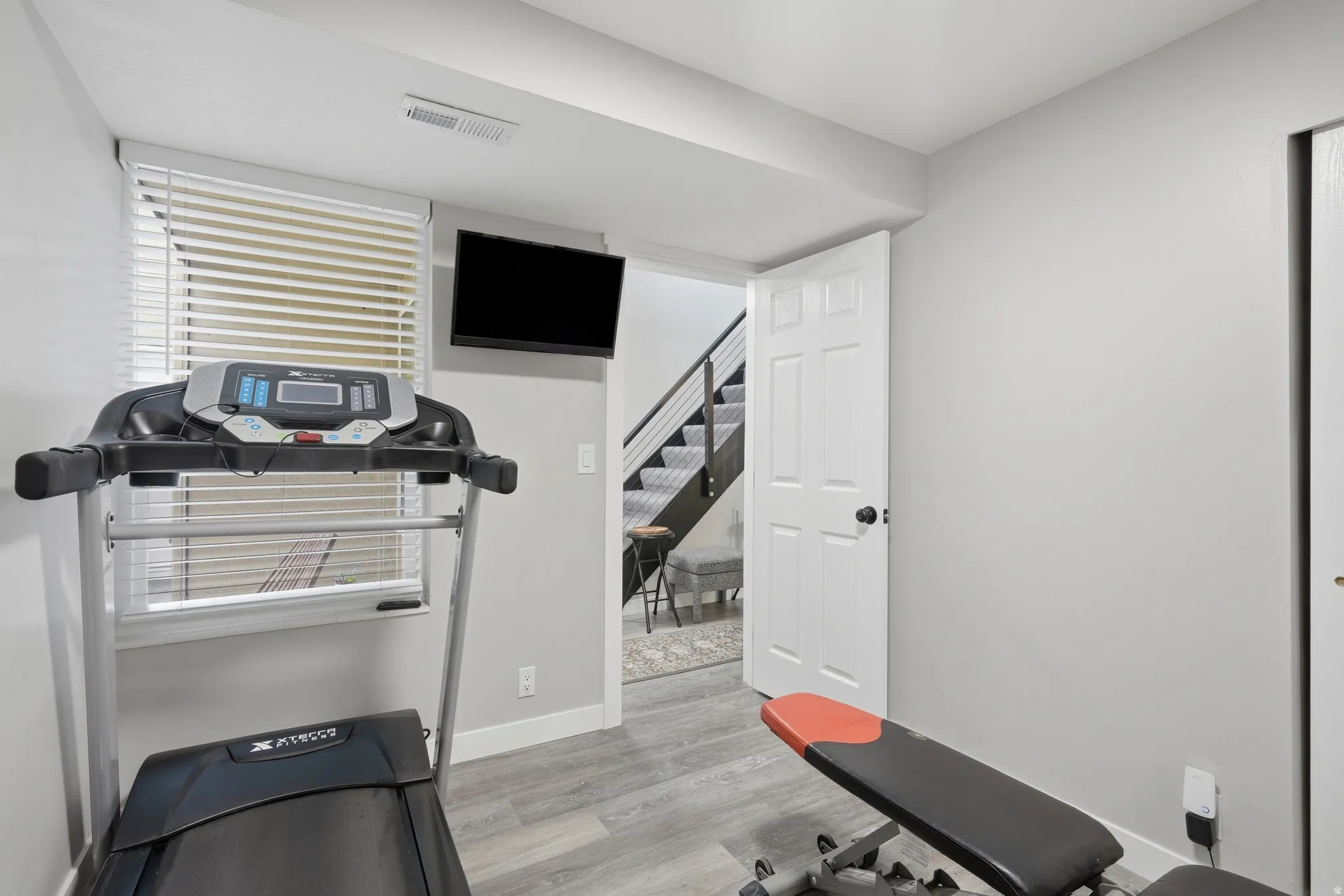 Bedroom 2 currently used as a home gym.