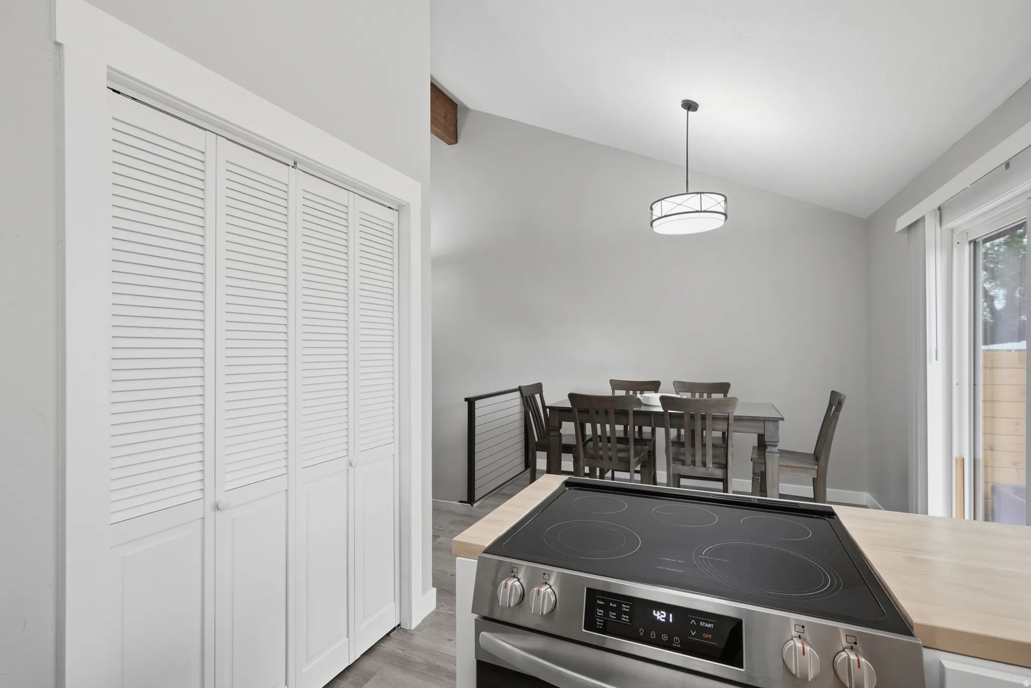Kitchen with view of small pantry and dining room.