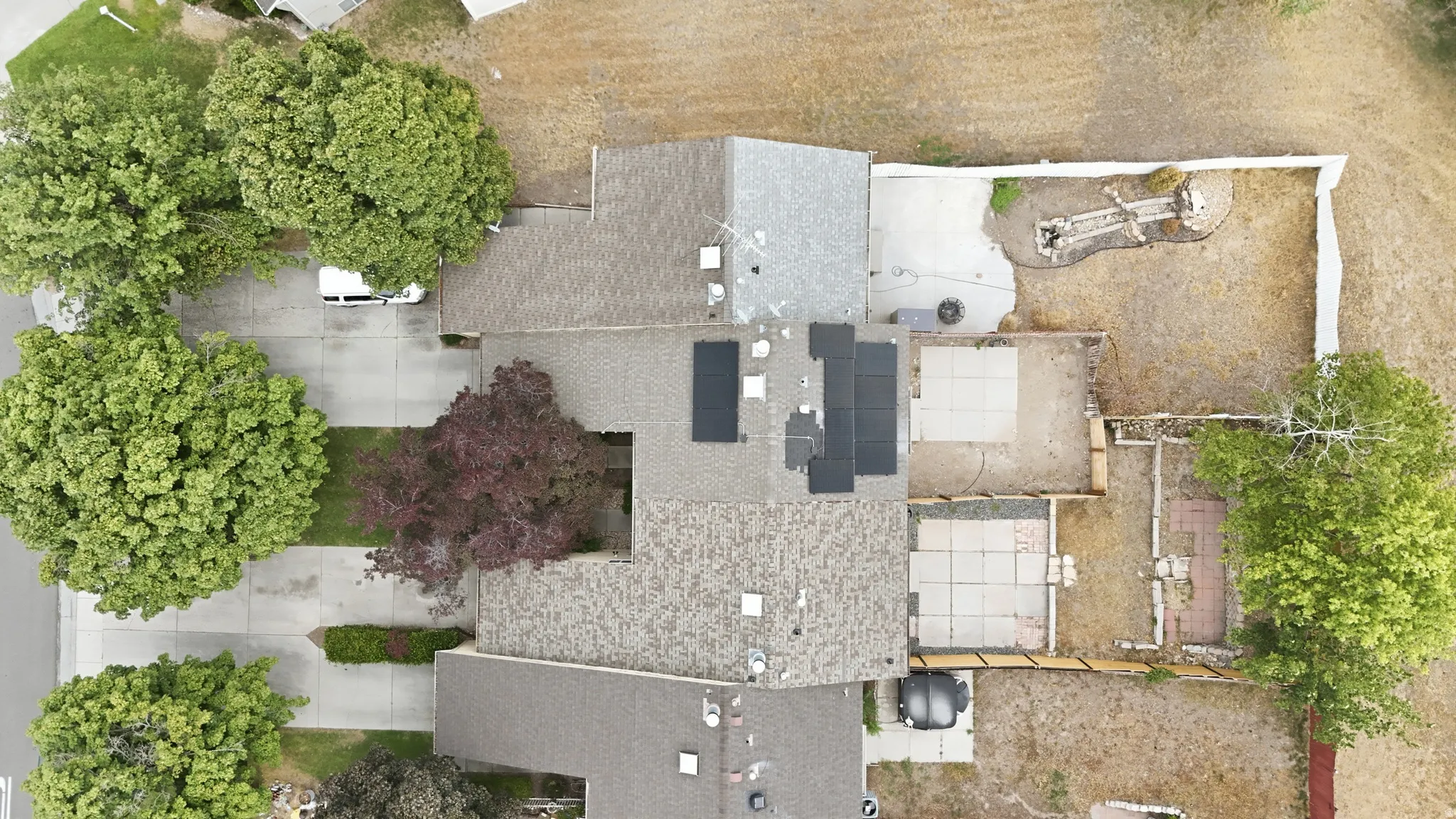 Arial view of home, community area behind backyard and to the side of the row.