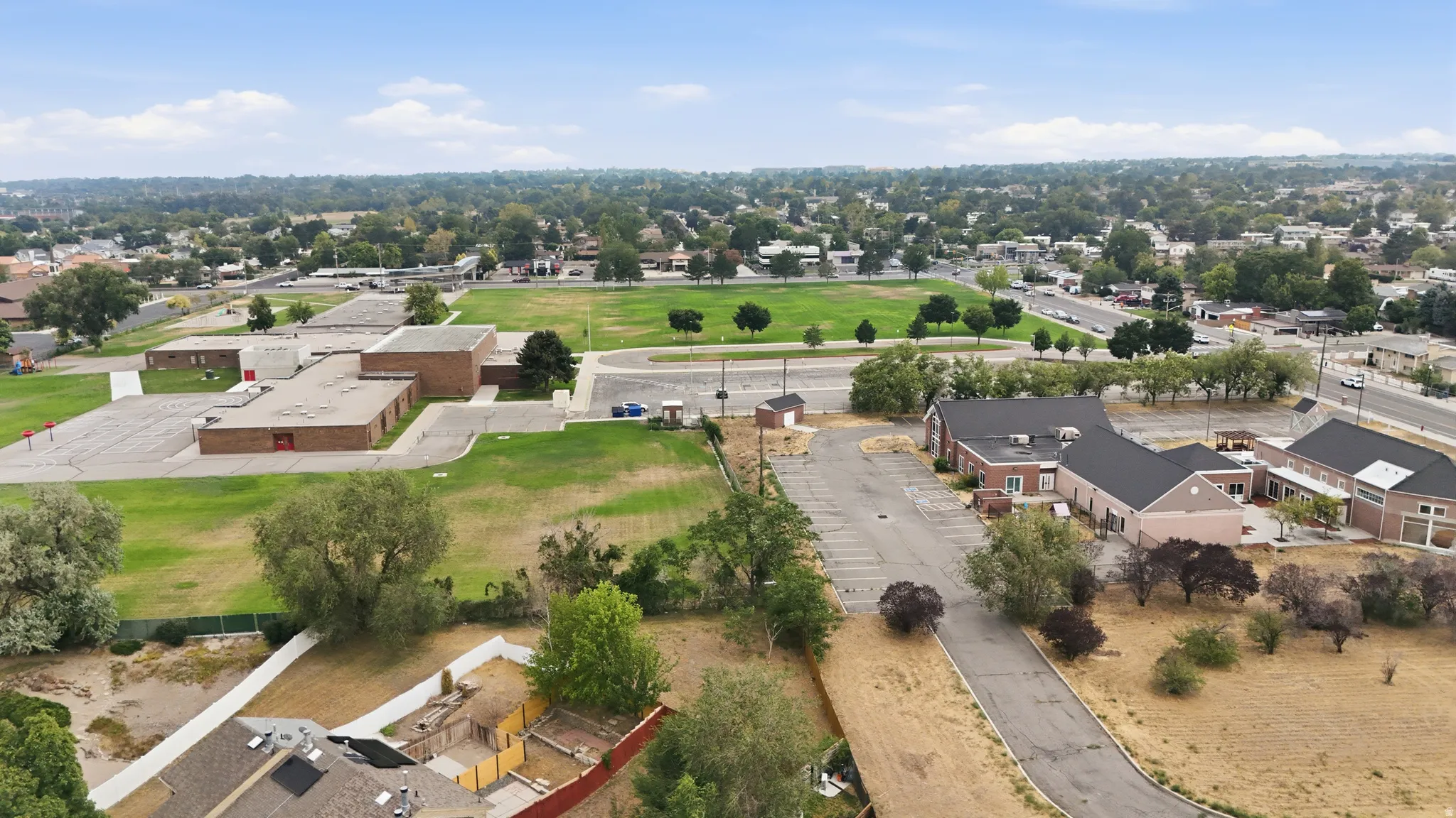 View of community area (triangle) behind back fence