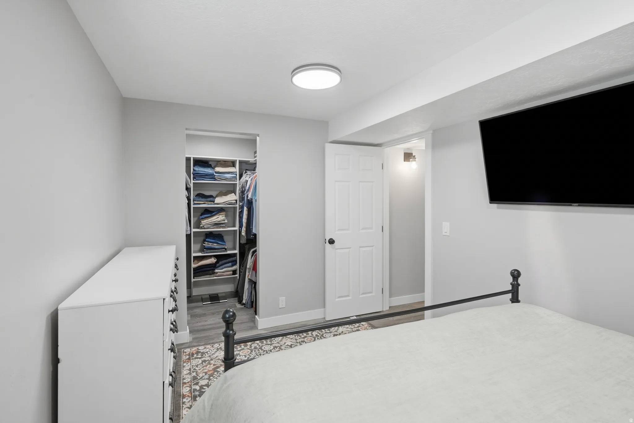 Primary bedroom with view of walk in closet