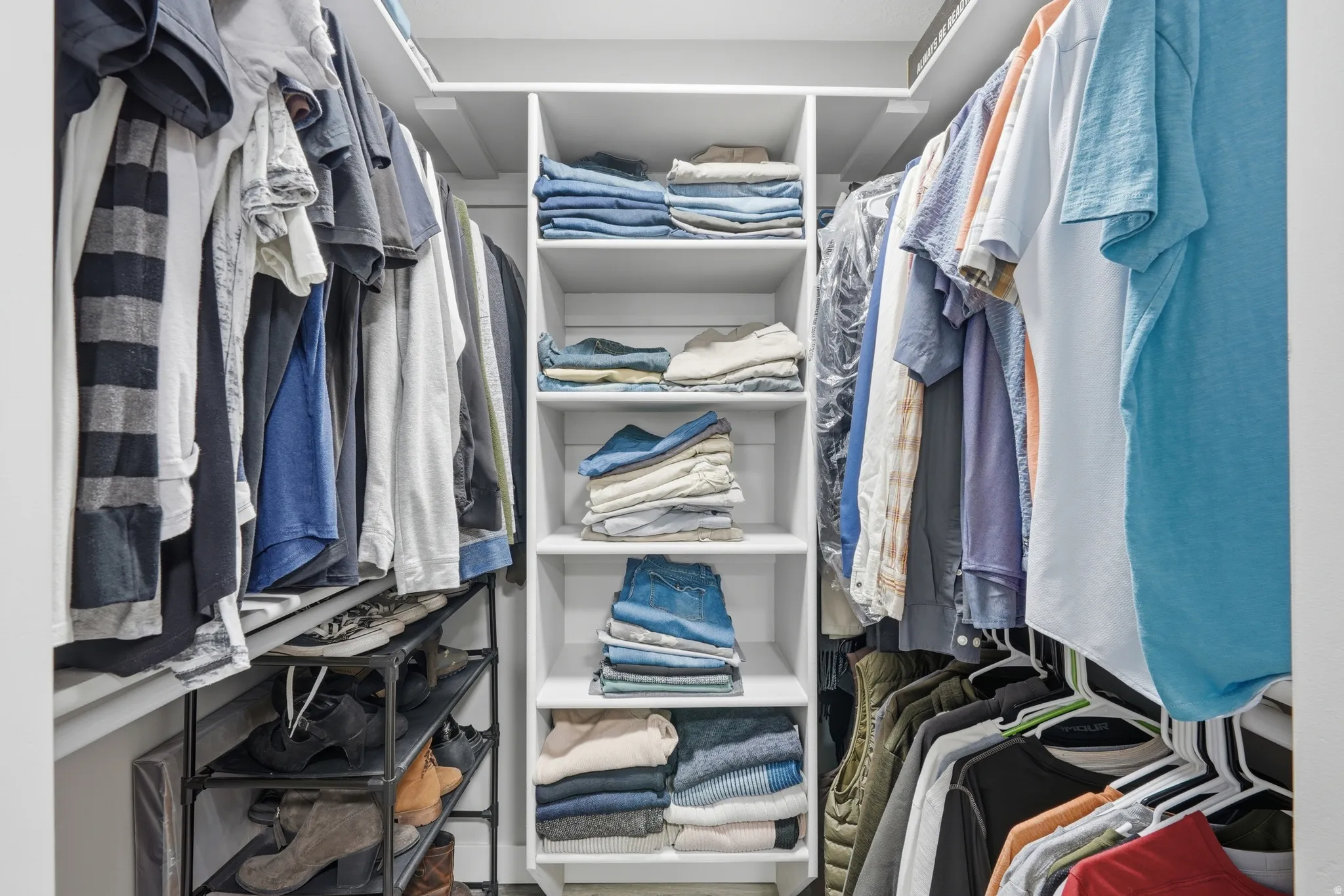 Primary bedroom walk in closet