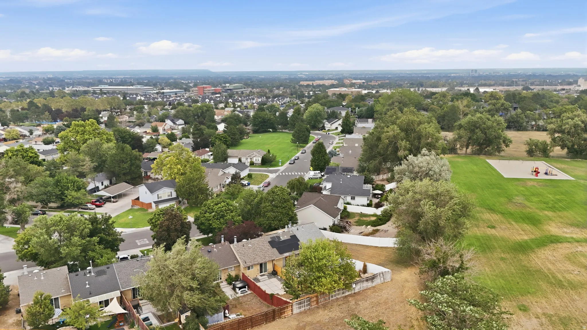 View of community area (triangle) behind back fence