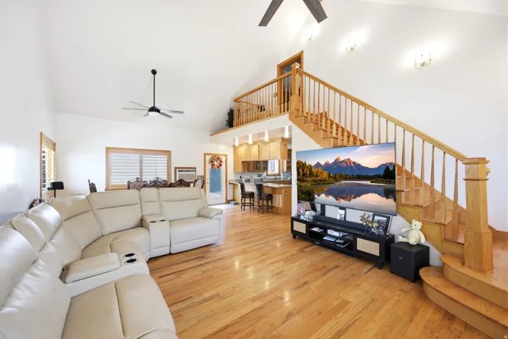 Main home - Vaulted ceiling living area with wood-finish flooring