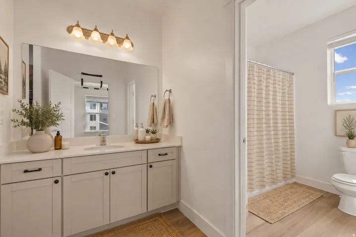 Dual vanity featuring a generous countertop and undermount sink