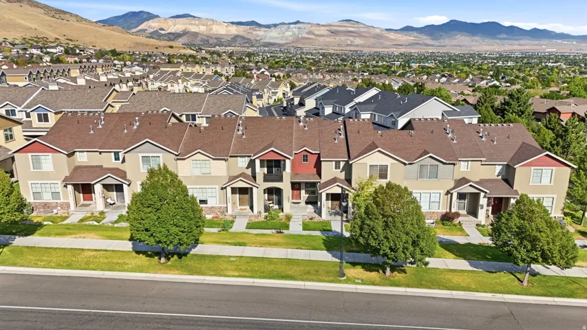 Townhome row featuring diverse exterior color palettes and architectural elements