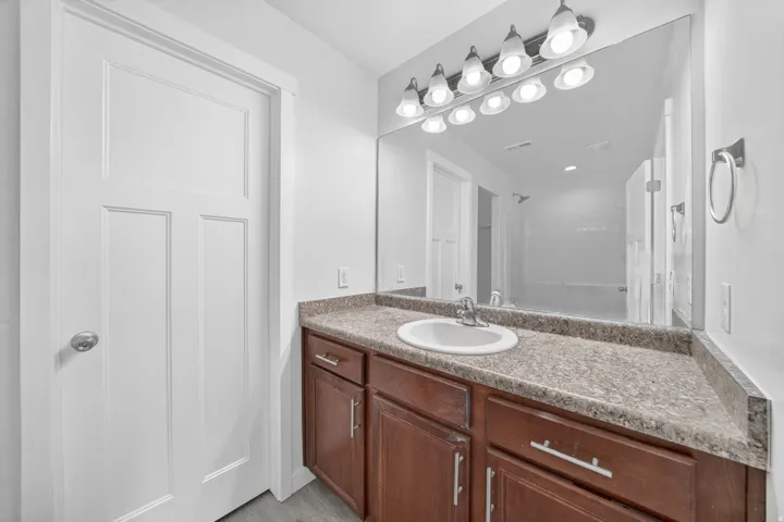 Vanity with a built-in sink and a textured countertop