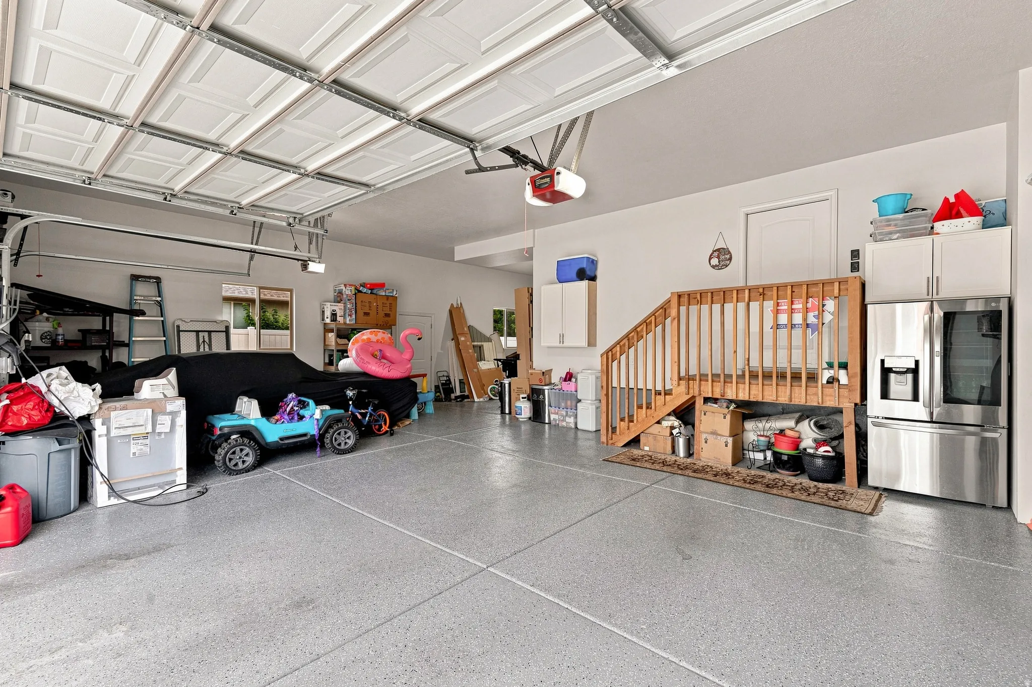 NEW Epoxy Floor, Finished and Painted Walls, NEW Metal Attached Storage Shelves, 2 EV Charging  Outlets, Wifi Garage Openers
