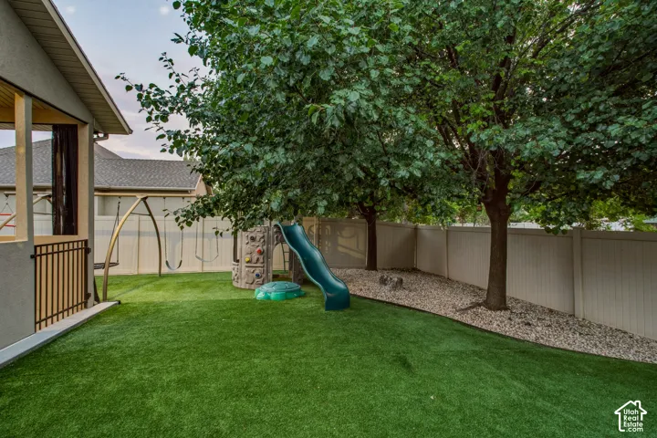 Beautiful Backyard with Shade/Privacy Trees and Playground Equipment