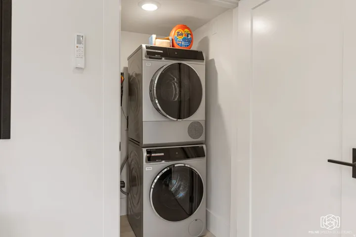 ADU stackable washer and dryer unit in a recessed alcove