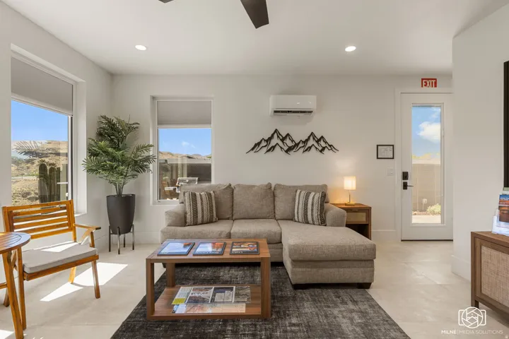 ADU living space featuring light-toned walls, recessed lighting, and a white ceiling fan
