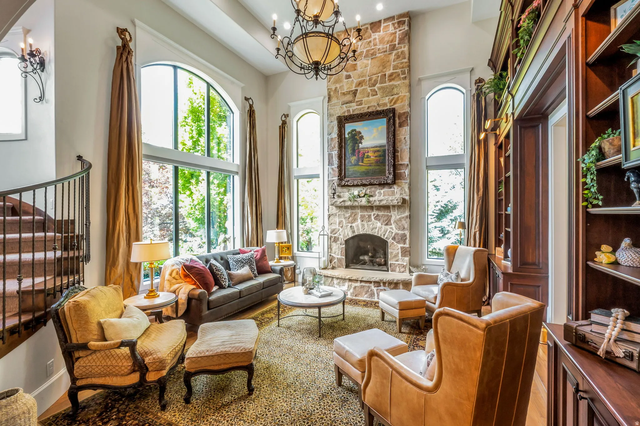 Grand living area featuring soaring ceilings and extensive natural light