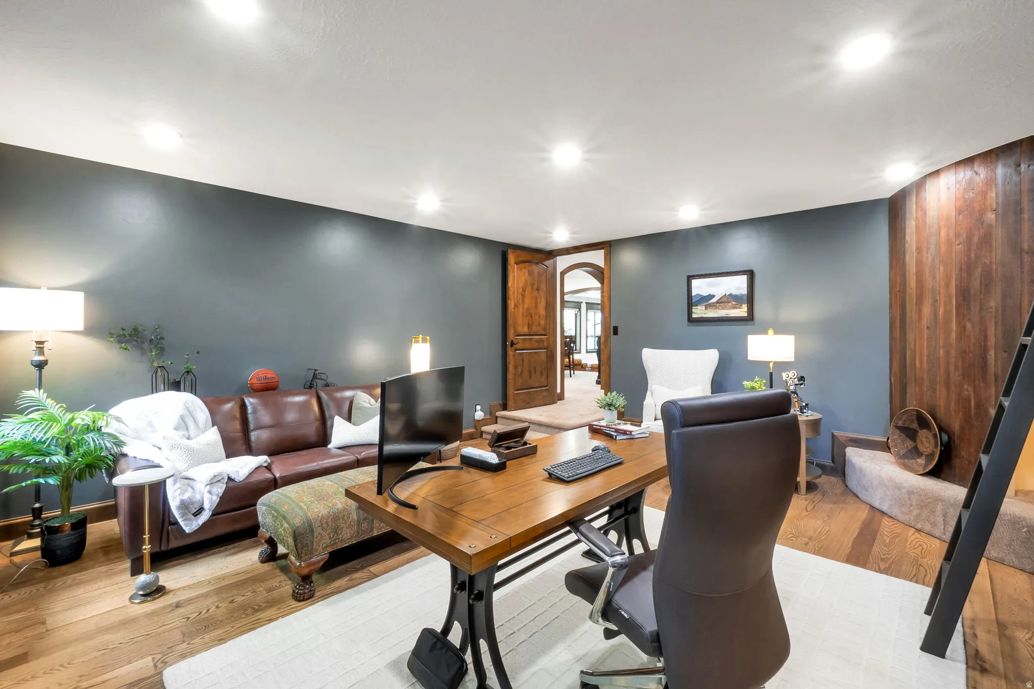 Interior space featuring wood-finish flooring, recessed ceiling lighting, and a neutral wall color