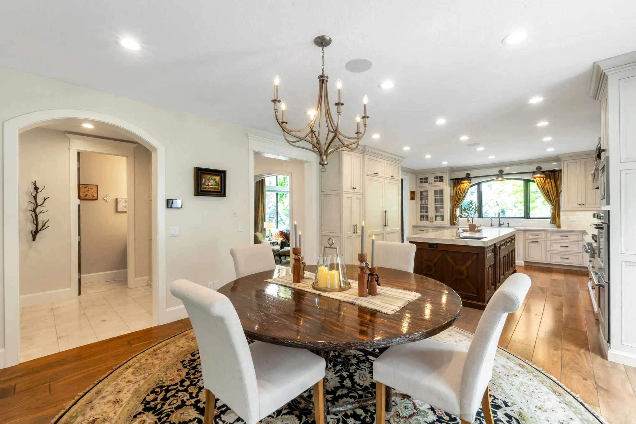 Open-concept kitchen and dining area with hardwood flooring