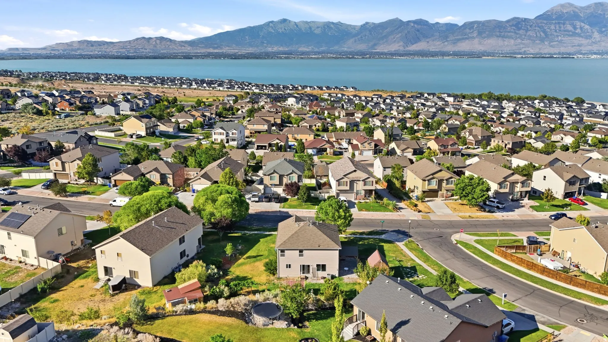 Residential neighborhood with established homes, mature landscaping, and paved streets