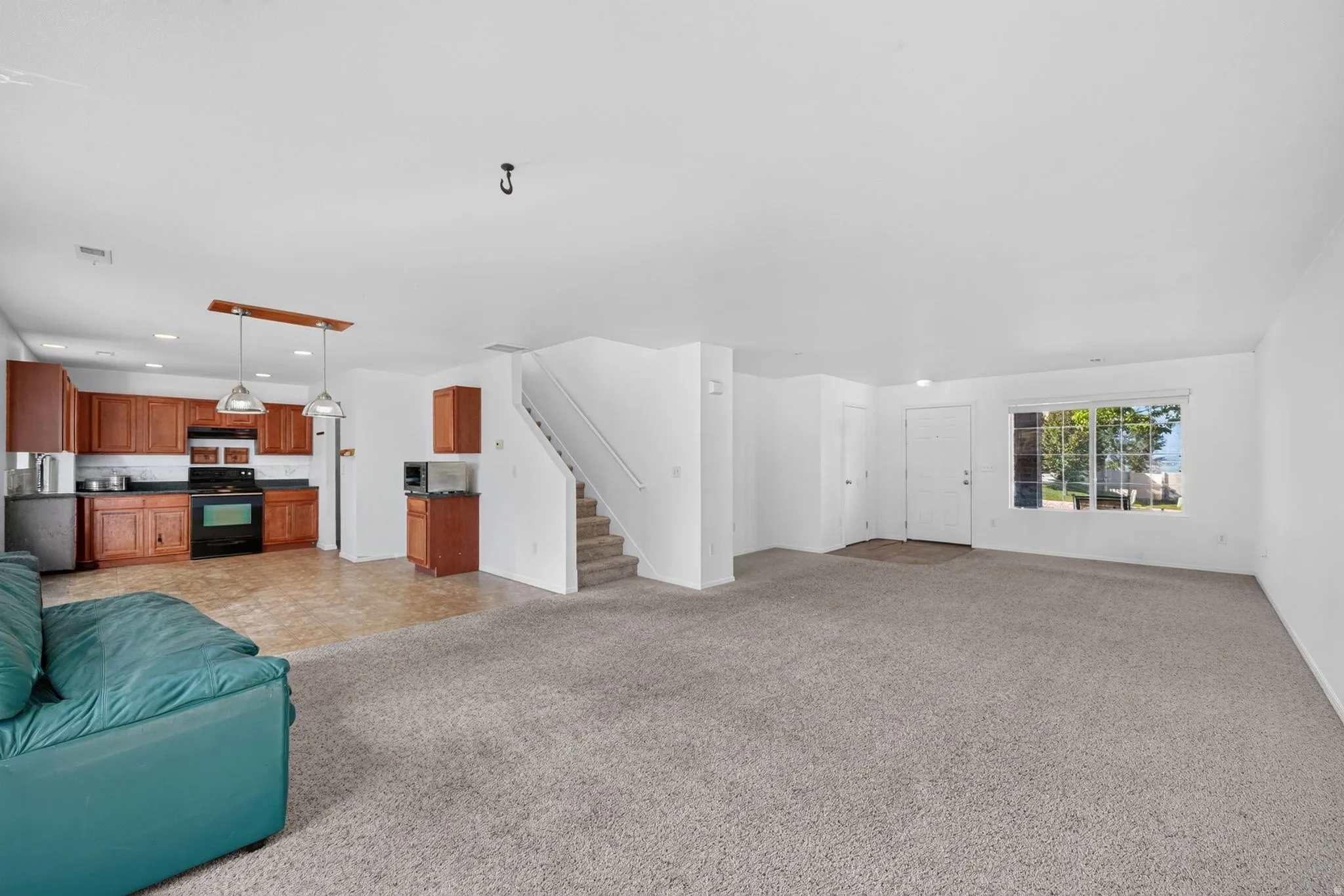 Open-concept living space featuring a combined kitchen and living area