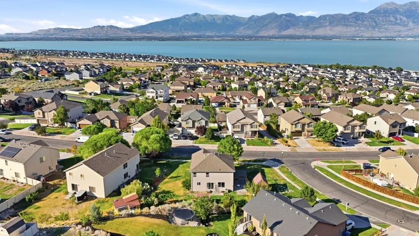 Residential neighborhood with established homes, mature landscaping, and paved streets